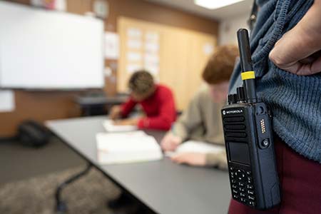 2 Way Radios being on the hip of a teacher during school